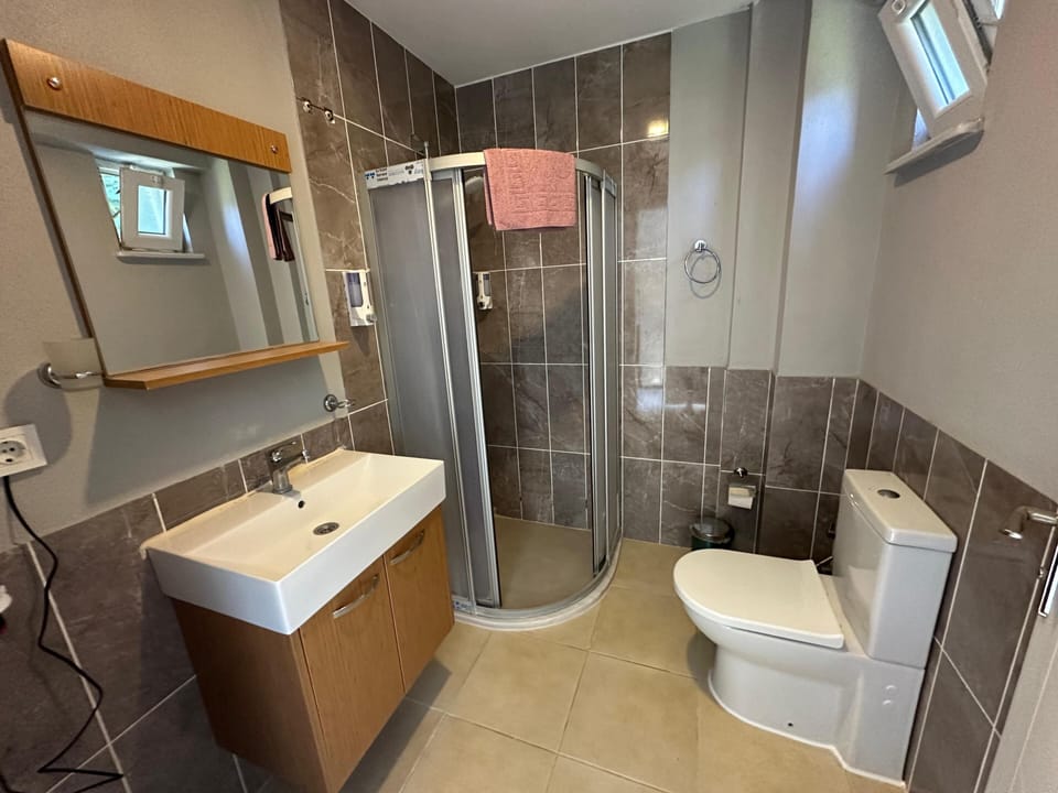 Shower, slippers, towels, soap