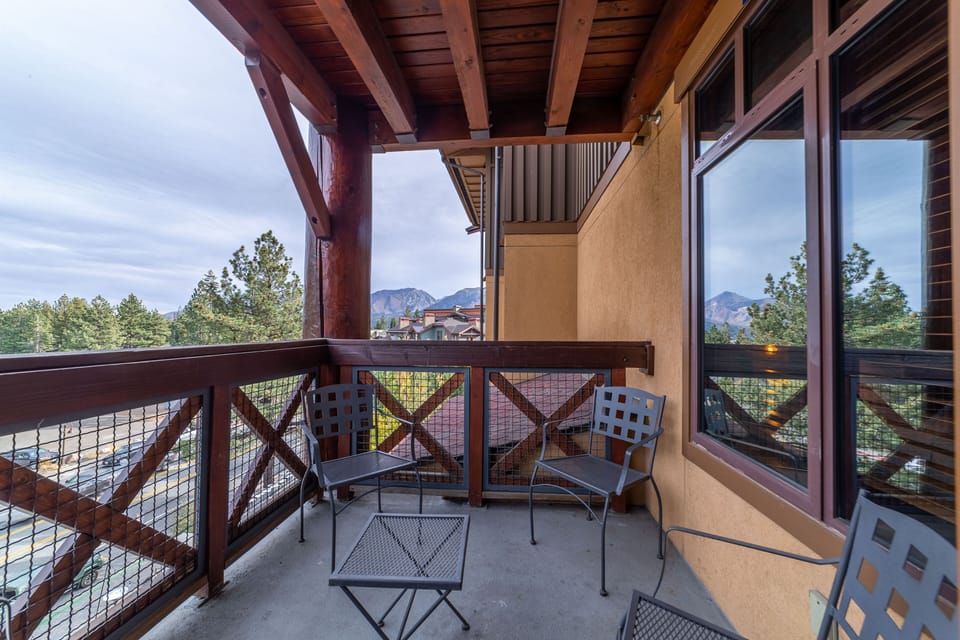Private deck with mountain and forest views.