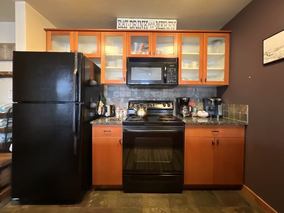 Kitchen is fully stocked with everything needed to cook a nice meal.