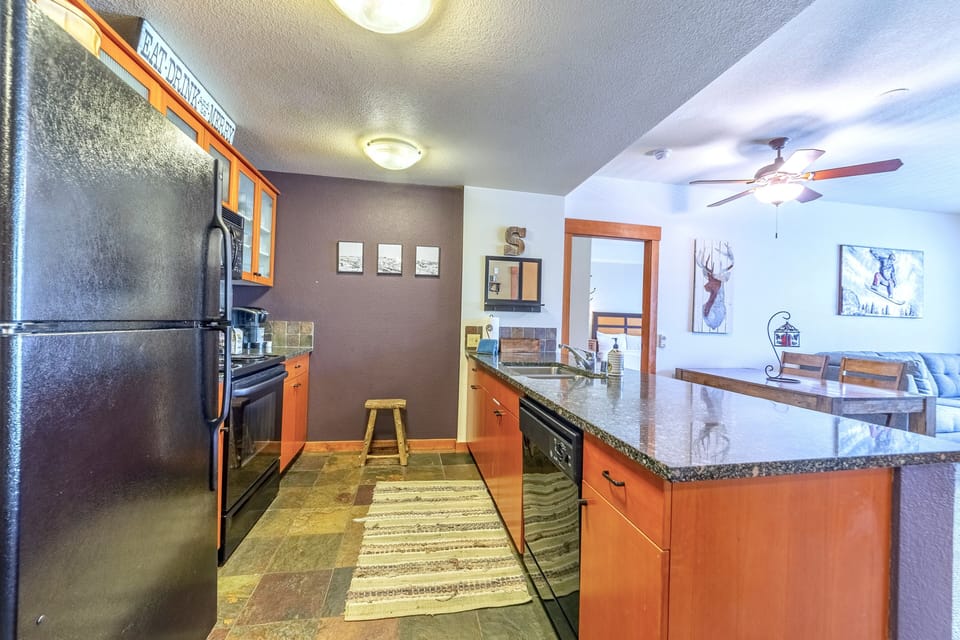 Galley kitchen open to living area.