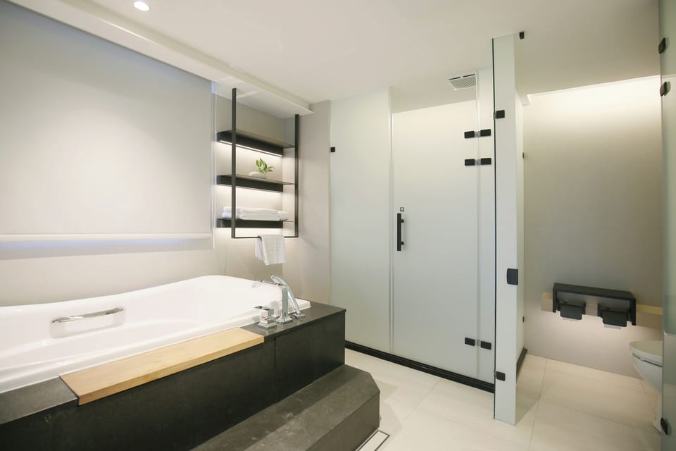 Dandy Suite | Bathroom | Hair dryer, slippers, towels