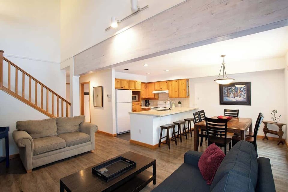 - Open-concept living with seamless kitchen and dining flow  
- Vaulted ceilings enhance space and natural light throughout  
- Perfect for group stays with social, connected layout  
