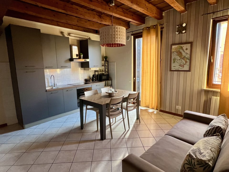 Deluxe Condo | Living area | Flat-screen TV