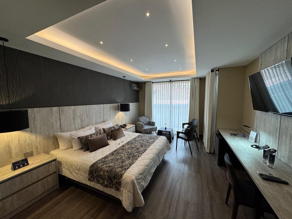 Grand Room, City View | In-room safe, desk, laptop workspace, iron/ironing board