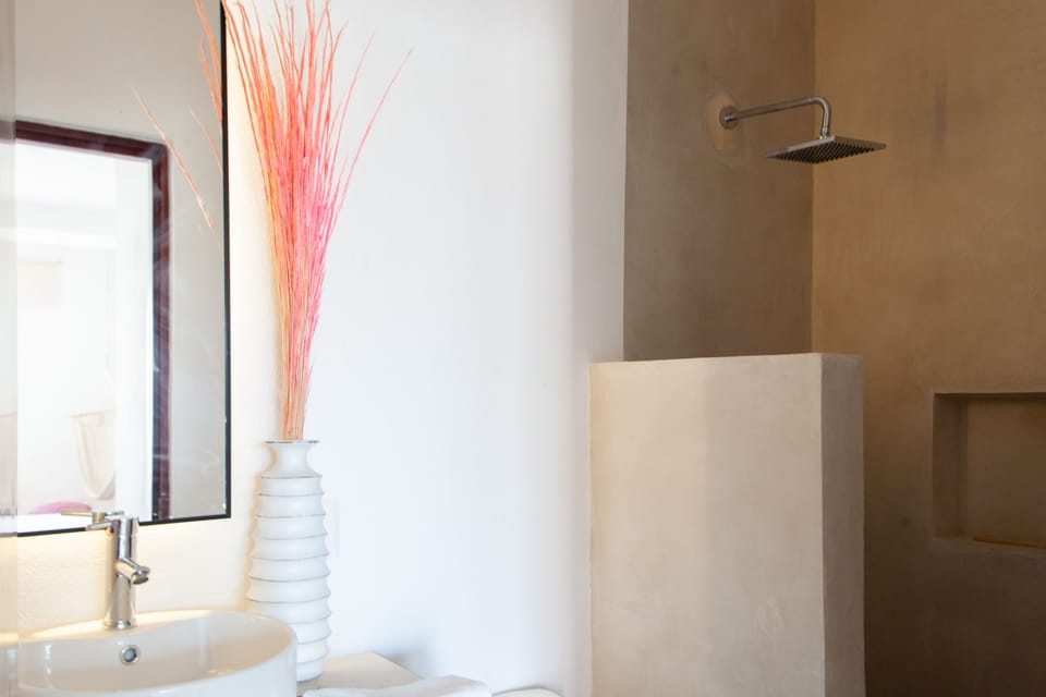 Signature Apartment, 1 King Bed | Bathroom | Shower, free toiletries, hair dryer, bathrobes
