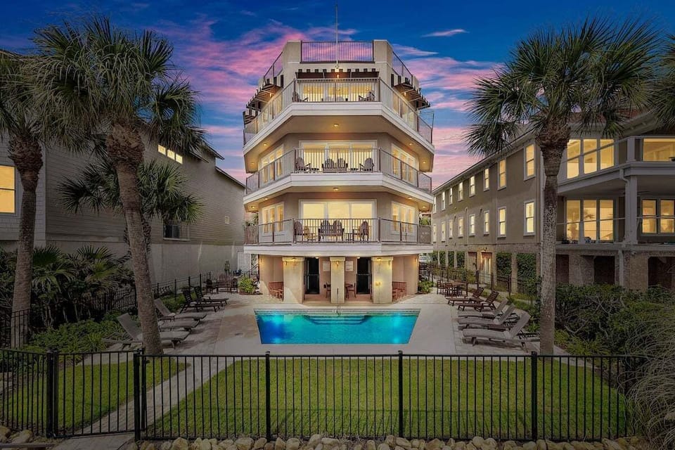 Full exterior view of property with outdoor pool