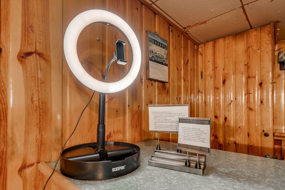 Step into your cozy rustic workspace with a professional ring light and wooden charm surrounding you.