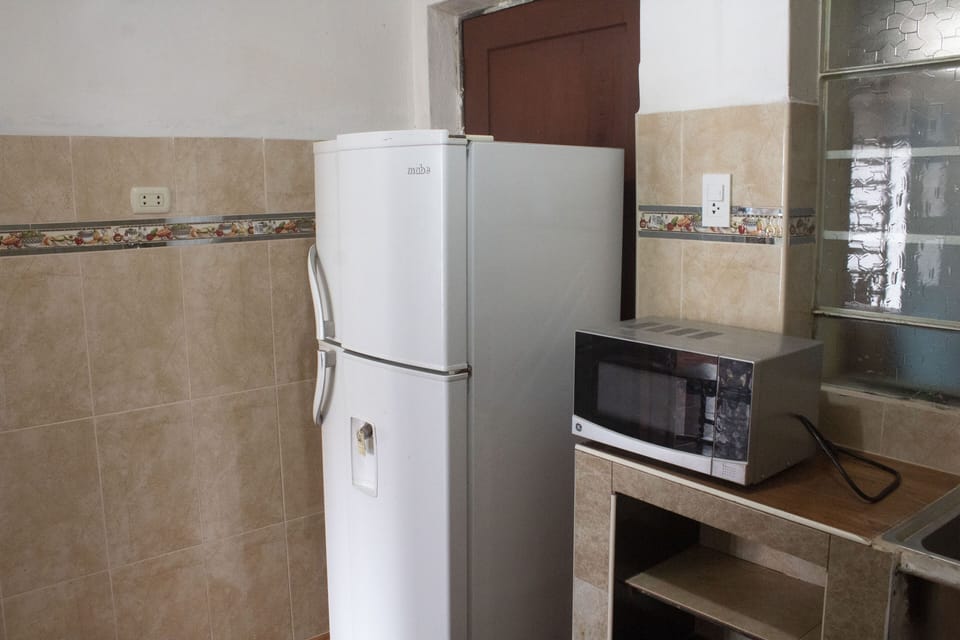 Fridge, microwave, stovetop, cookware/dishes/utensils