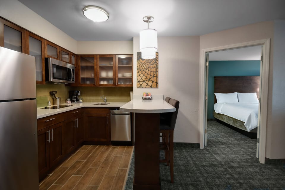 Desk, laptop workspace, blackout drapes, iron/ironing board