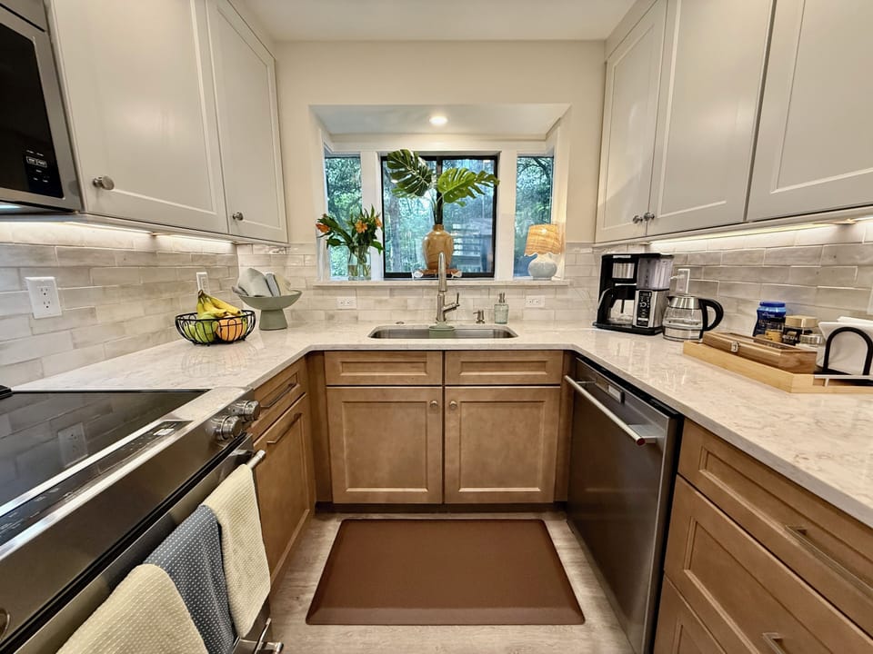 Kitchen with specialty coffee maker, drip coffee maker, and electric kettle
