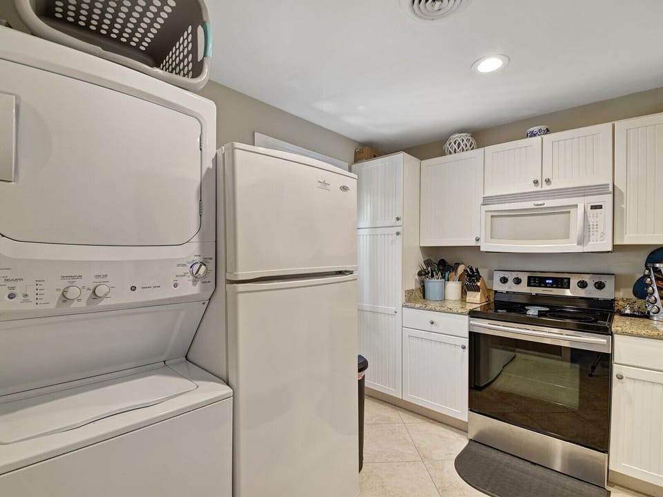Kitchen with Stacked Washer/Dryer at 508 Queens Grant