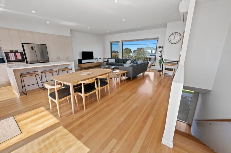 The spacious, light-filled living area upstairs is perfect for relaxing