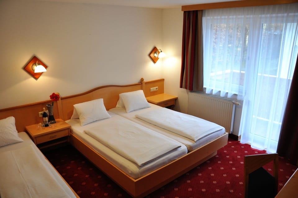 Triple Room | In-room safe, desk, laptop workspace, blackout drapes