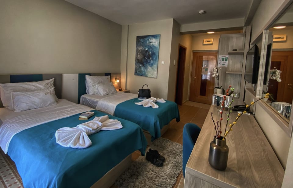 Double or Twin Room, Sea View | In-room safe, desk, laptop workspace, blackout drapes