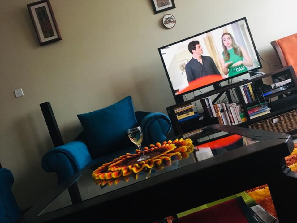 Apartment, 3 Bedrooms | Living room | Flat-screen TV