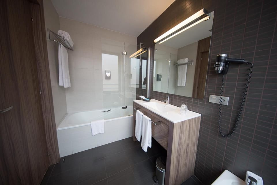 Bathtub, designer toiletries, hair dryer, bidet