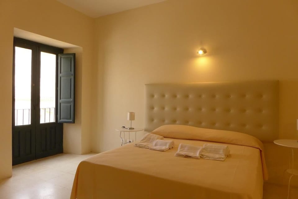 Superior Quadruple Room | Minibar, in-room safe, desk, blackout drapes