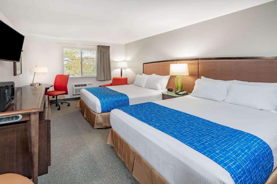 Room, 2 Queen Beds, Non Smoking | Individually furnished, desk, laptop workspace, blackout drapes