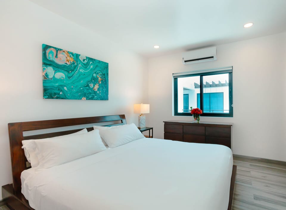 Deluxe Penthouse, 2 Bedrooms, Pool Access, Ocean View (Sea Front) | In-room safe, soundproofing, iron/ironing board, travel crib