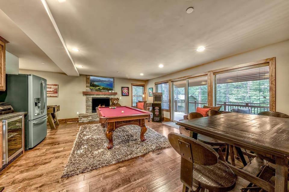 Spacious game room with pool table and scenic window views