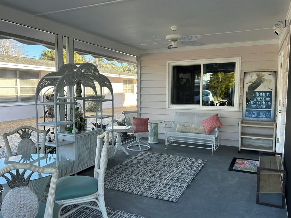 New screened Florida Room-for relaxing alone or together outside sans bugs!