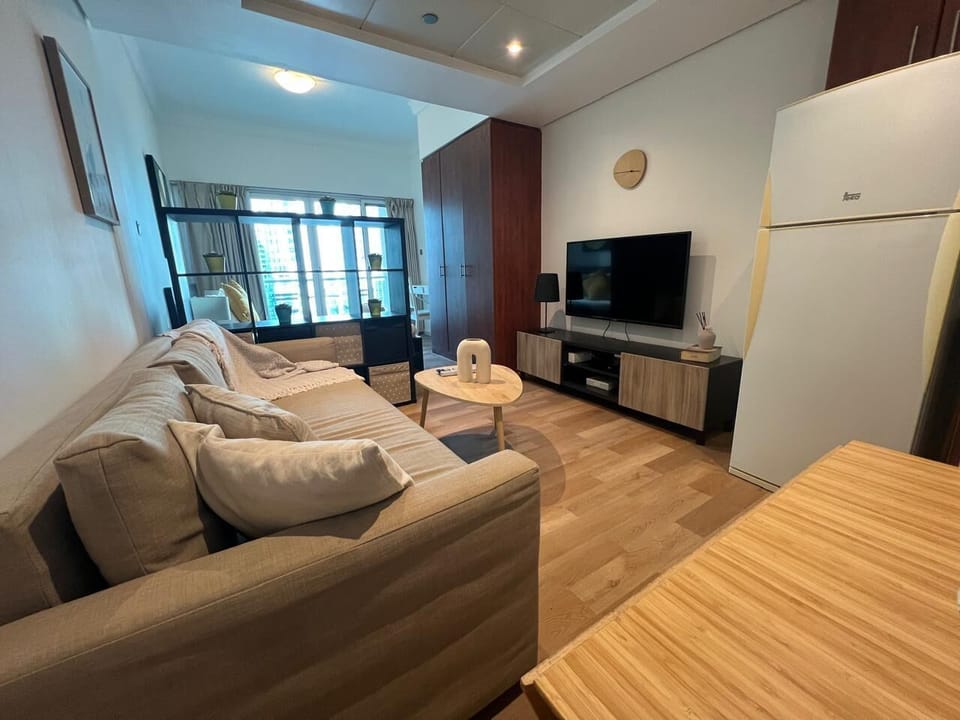 Comfort Studio | Living area | 65-inch Smart TV with cable channels, TV, Netflix