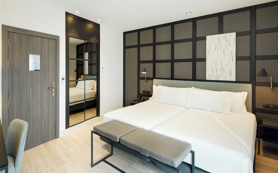 Classic Twin Room | Down comforters, minibar, in-room safe, individually decorated