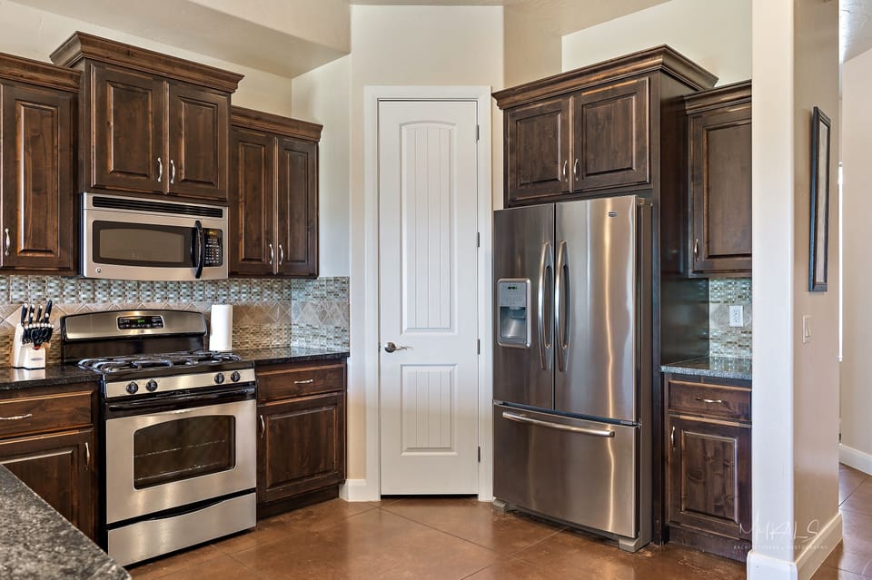 Townhome, 3 Bedrooms | Private kitchen | Fridge, microwave, oven, dishwasher