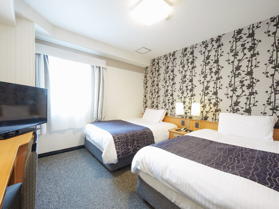 Desk, blackout drapes, WiFi (free), bed sheets