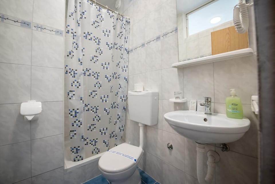 Shower, eco-friendly toiletries, hair dryer, towels