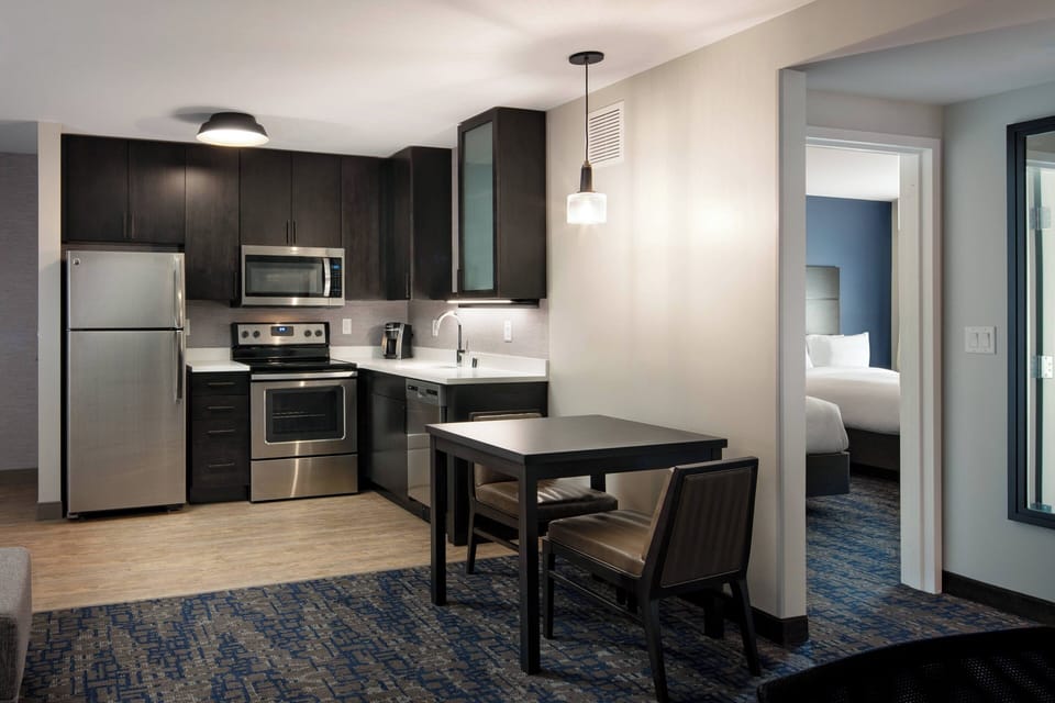 Suite, 1 Bedroom | Private kitchen | Full-size fridge, microwave, stovetop, dishwasher