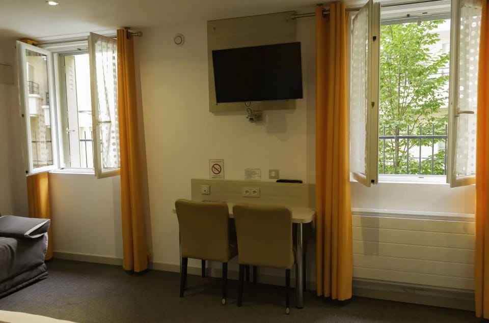 Desk, laptop workspace, blackout drapes, soundproofing