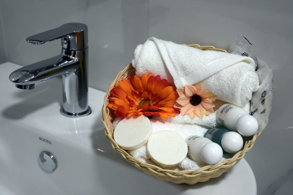 Family Room | Bathroom | Shower, slippers, towels