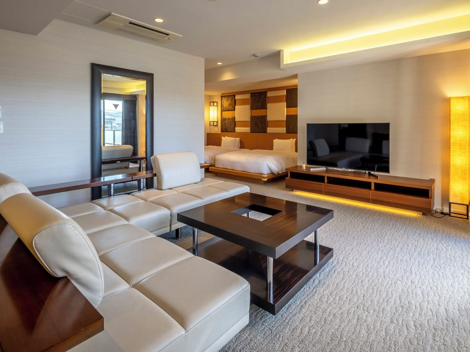 Deluxe Twin Room A with Open Air Bath | Living area | 40-inch flat-screen TV with digital channels, TV