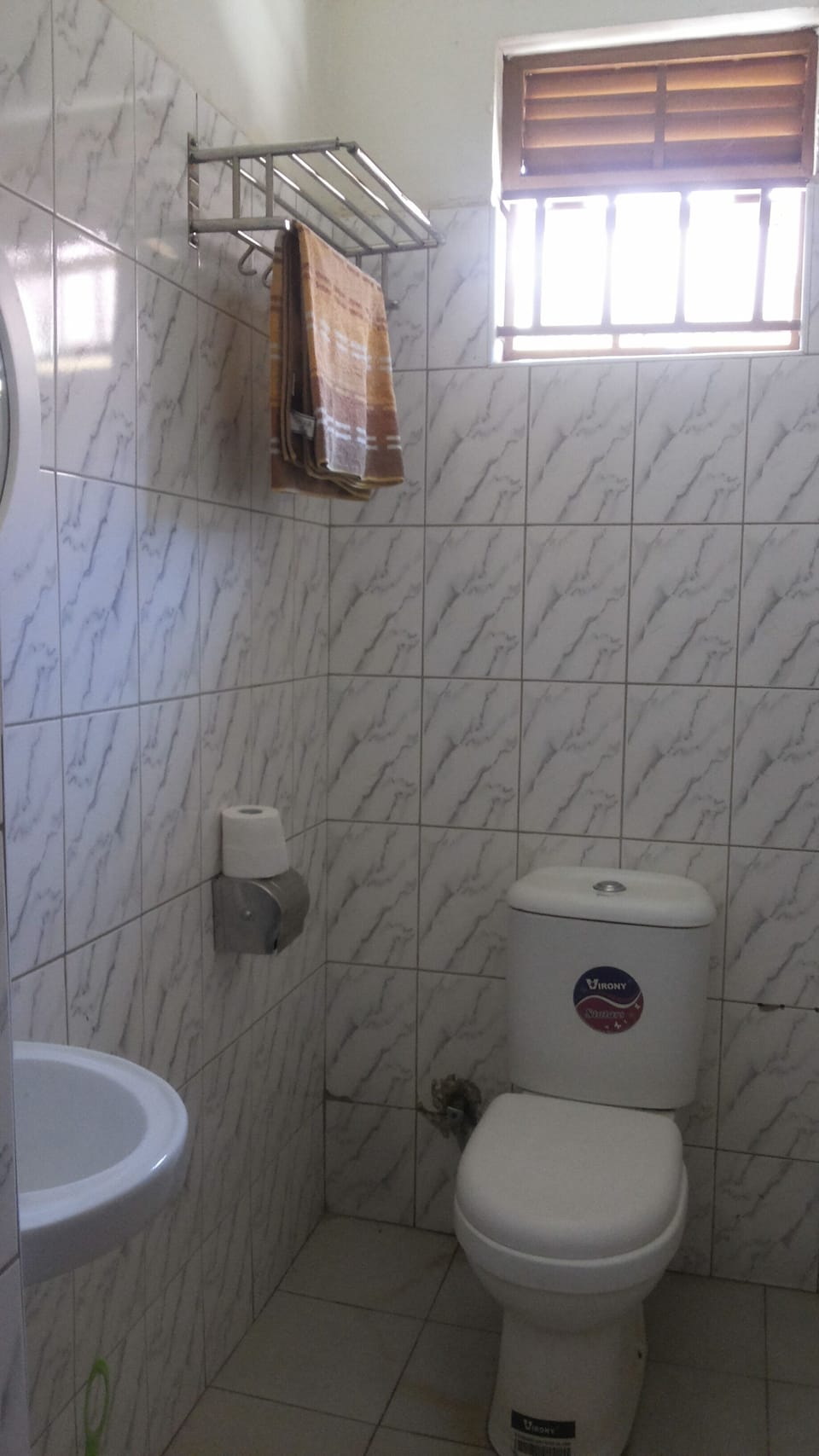 Shower, rainfall showerhead, slippers, towels
