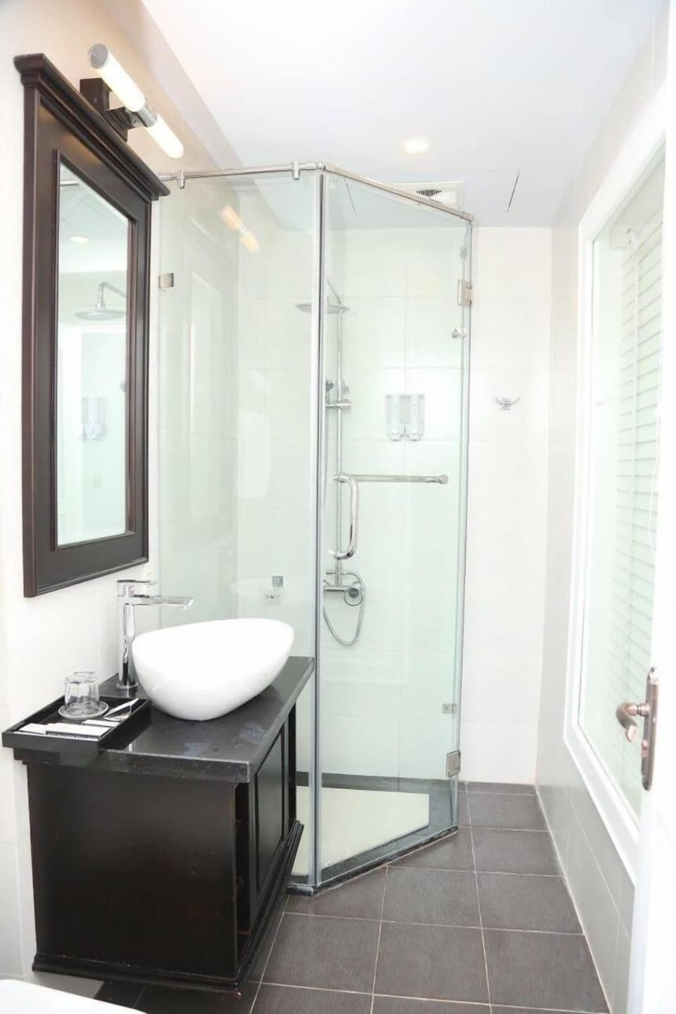 Shower, rainfall showerhead, designer toiletries, hair dryer