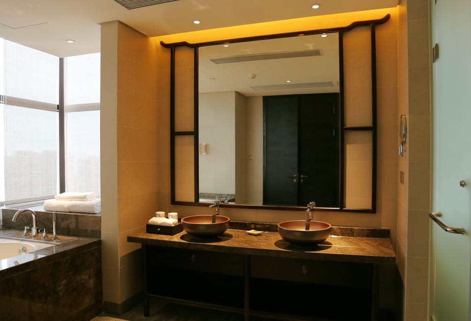 Business Studio Suite, meat products are not allowed, proof of marriage is required for couples. | Bathroom | Free toiletries, hair dryer, bathrobes, slippers