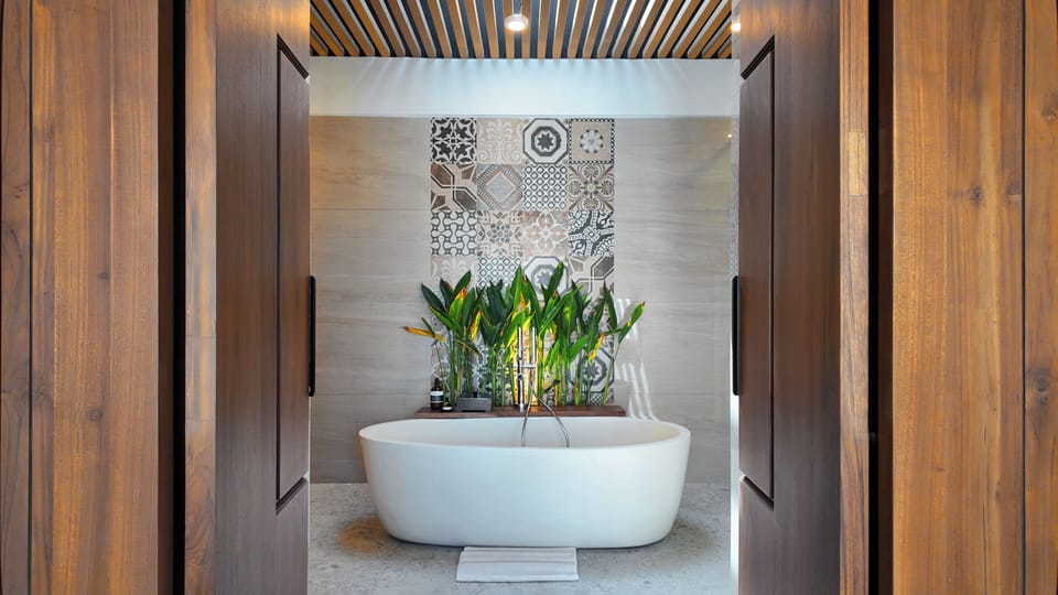 Separate tub and shower, rainfall showerhead, free toiletries
