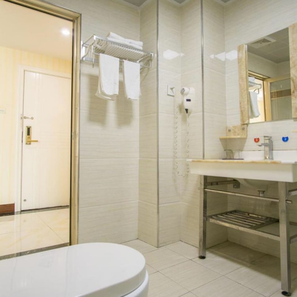 Shower, free toiletries, slippers, towels