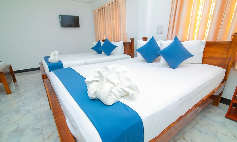 Family Room, Multiple Beds, Private Bathroom, Ground Floor | Individually furnished, desk, laptop workspace, soundproofing