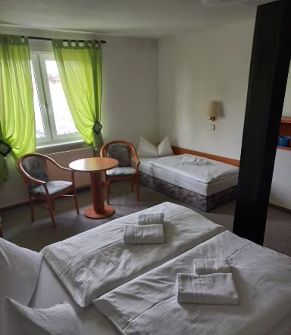 Triple Room | Blackout drapes, iron/ironing board, cribs/infant beds, free WiFi
