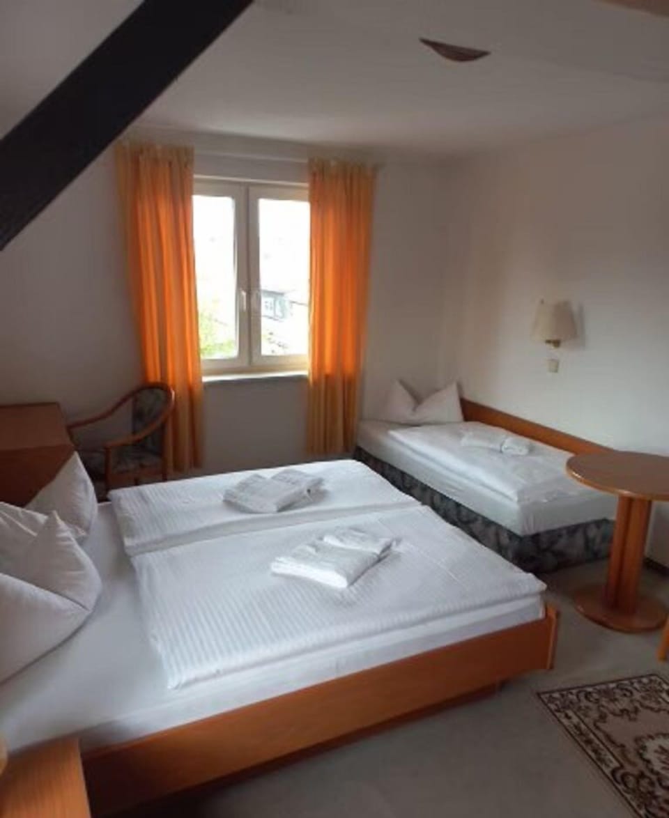 Triple Room | Blackout drapes, iron/ironing board, cribs/infant beds, free WiFi