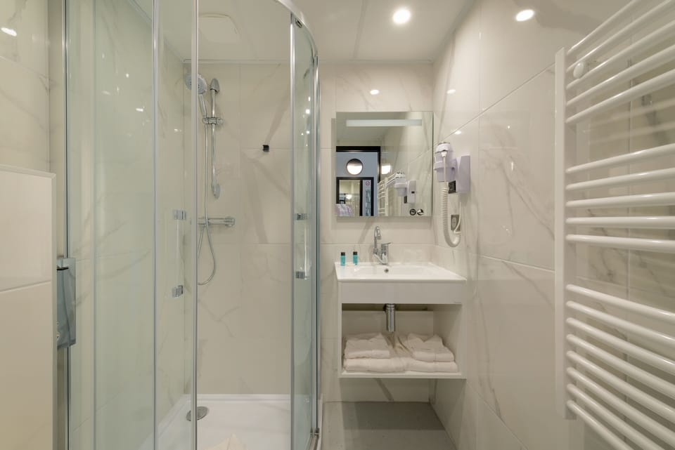 Hair dryer, towels, soap, shampoo