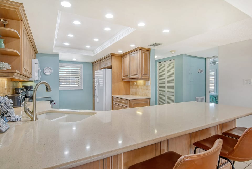 Modern updated kitchen granite counter tops, tile backsplash,  and new appliances