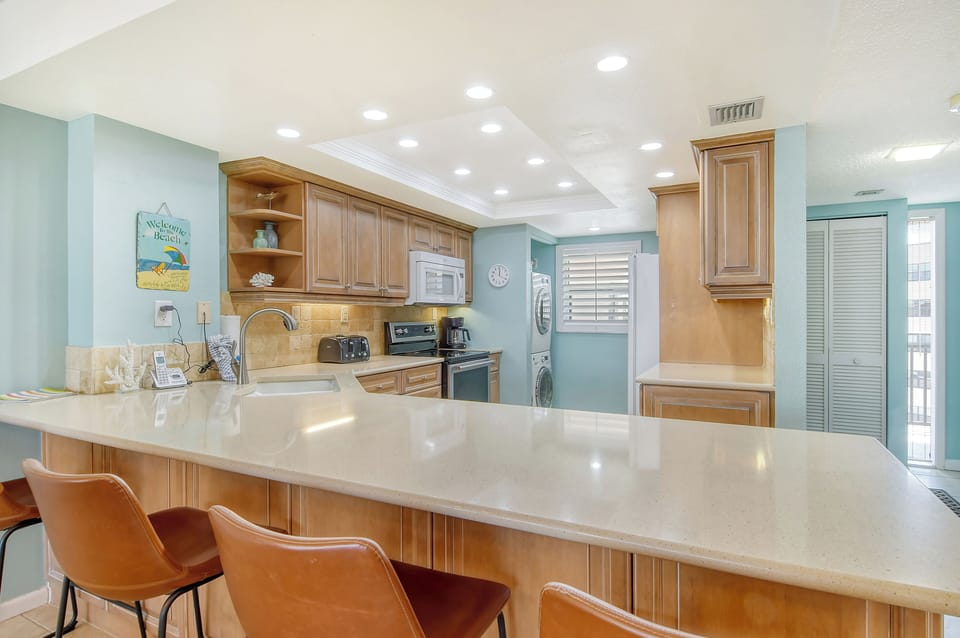 Modern updated kitchen granite counter tops, tile backsplash,  and new appliances