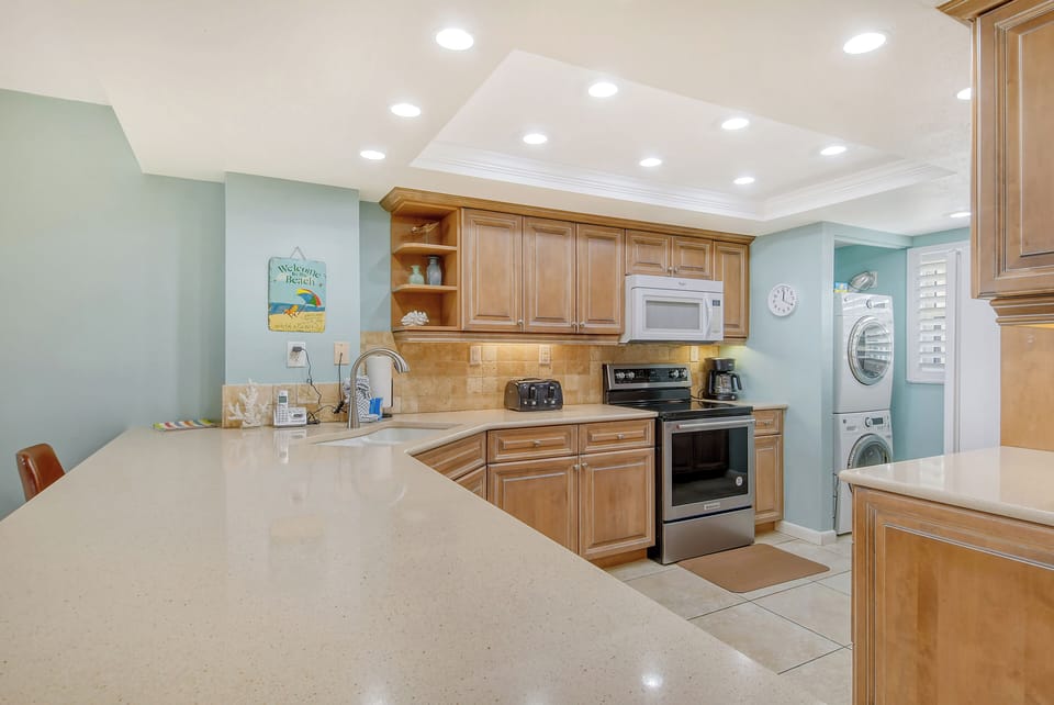 Modern updated kitchen granite counter tops, tile backsplash,  and new appliances