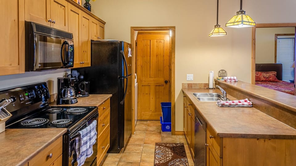 Condo, 2 Bedrooms | Private kitchen | Coffee/tea maker, fridge, microwave, oven
