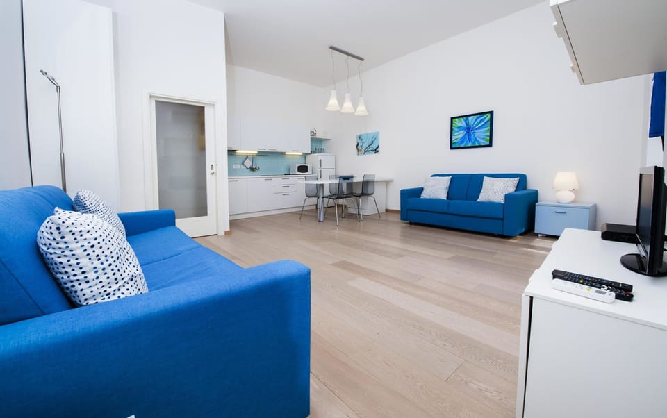 Apartment, 1 Bedroom, Sea View | Living area | 40-inch TV with cable channels