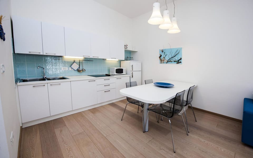 Apartment, 1 Bedroom, Sea View | Private kitchen | Full-size fridge, microwave, stovetop, coffee/tea maker