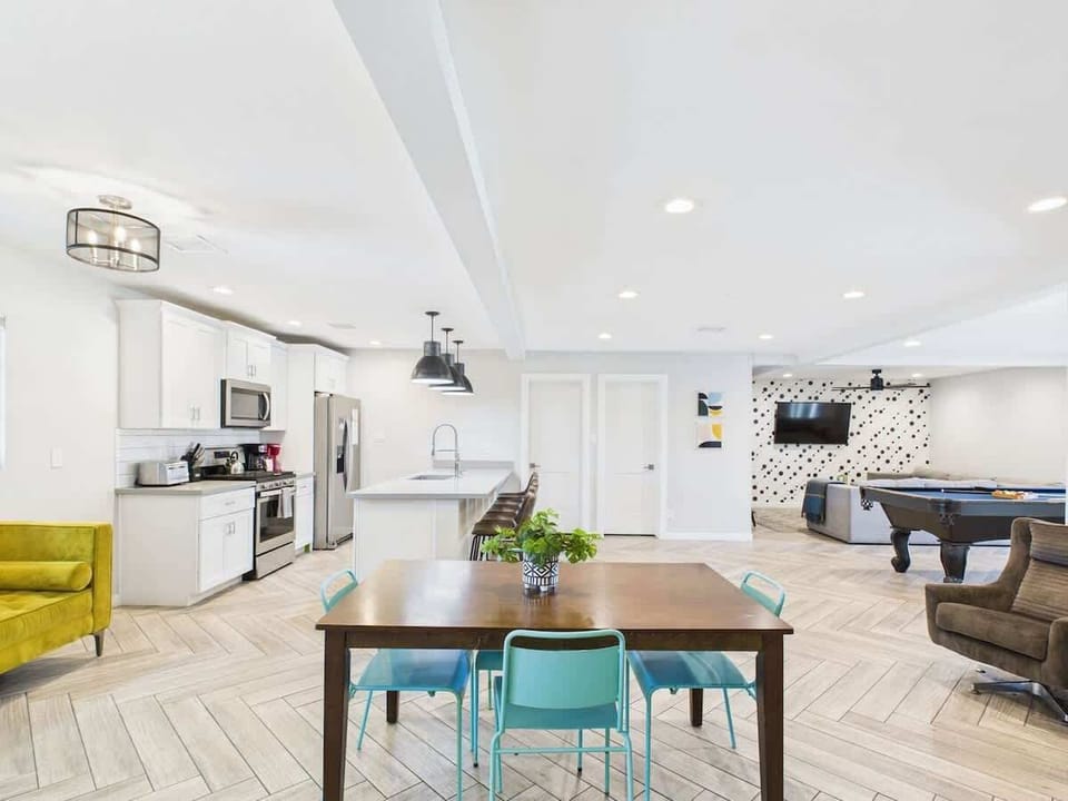 Gather around the dining table for meals and memories in this inviting space.